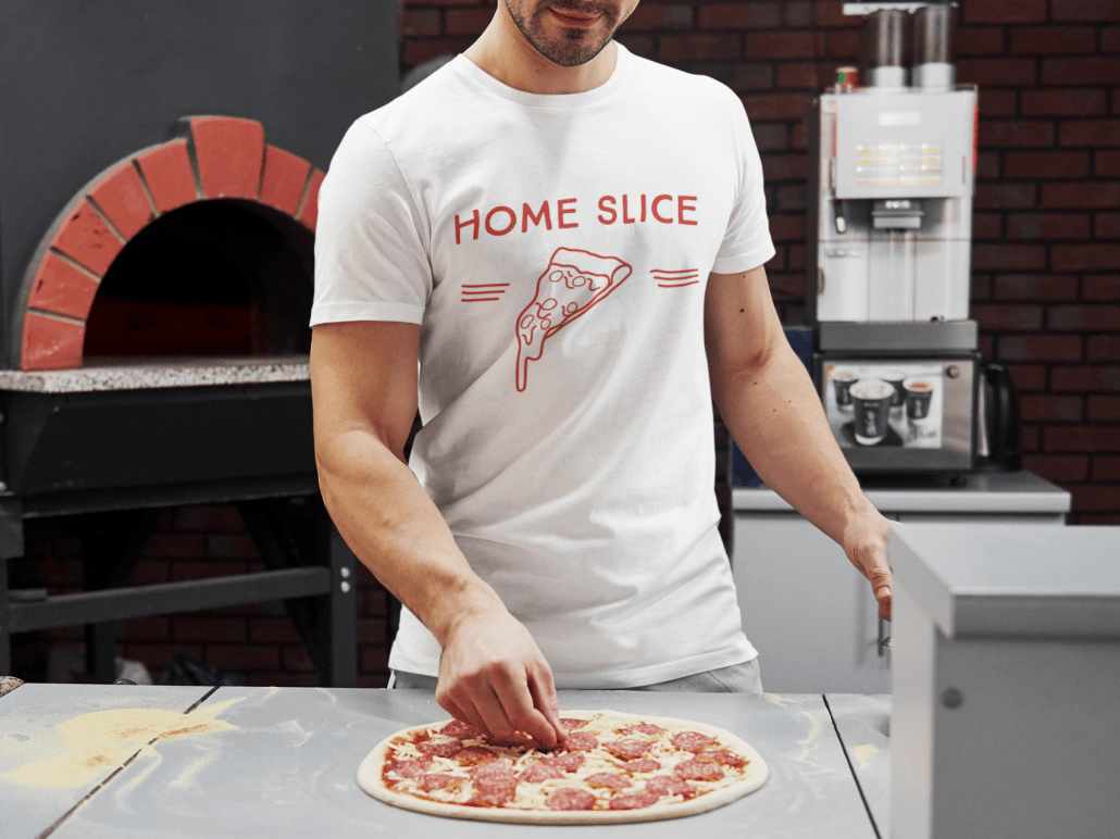 young man bakes pizza